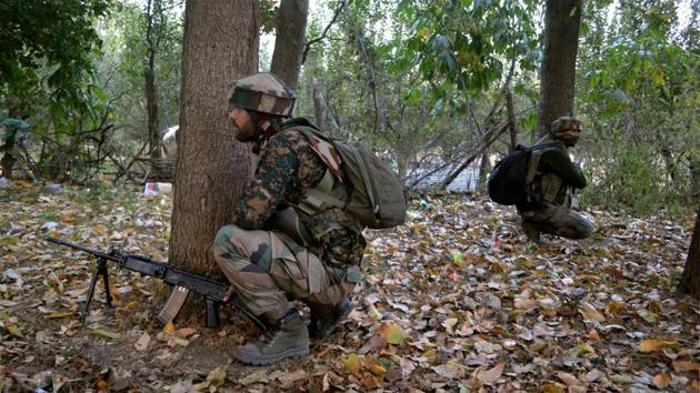 Army personnel take positions during an encounter in Gatipora Keller in Shopian district of south Kashmir. (PTI File Photo)