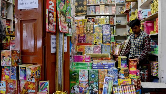 A shopkeeper waits for customers at his firecracker shop in New Delhi on October 9.(AFP) A shopkeeper waits for customers at his firecracker shop in New Delhi on October 9.(AFP)
