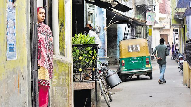 Fatima Nafees stands at the gate of her home at Mohalla Bendotola in Budaun, UP, on Wednesday.(Vipin Kumar/HT PHOTO)