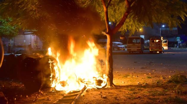 Mob had set several vehicles on fire outside Ramganj police station in violence that started after a petty dispute between locals and the police turned ugly. (Himanshu Vyas/HT Photo) Mob had set several vehicles on fire outside Ramganj police station in violence that started after a petty dispute between locals and the police turned ugly. (Himanshu Vyas/HT Photo)