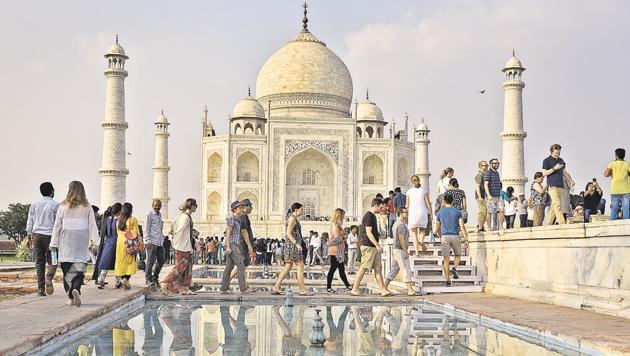 Tourists at the Taj Mahal, a UNESCO world heritage site. One of the most popular tourist draws in the country, India is often identified as the ‘land of the Taj’.(Burhaan Kinu/HT PHOTO)