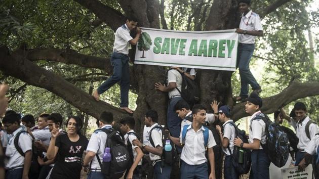 Volunteers protest against the construction of the Metro 3 car shed at Aarey Milk Colony (HT Photo) Volunteers protest against the construction of the Metro 3 car shed at Aarey Milk Colony (HT Photo)
