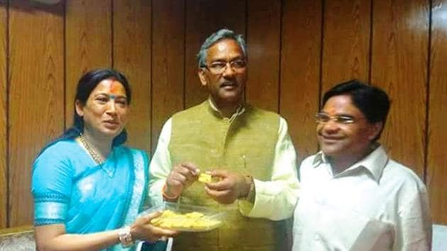 Girdharilal Sahu (right), his wife and Uttarakhand minister Rekha Arya (left) with chief minister Trivendra Singh Rawat. (HT File Photo) Girdharilal Sahu (right), his wife and Uttarakhand minister Rekha Arya (left) with chief minister Trivendra Singh Rawat. (HT File Photo)