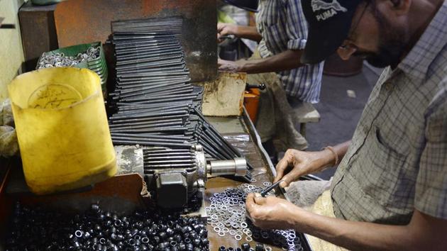 In this picture taken on September 26, 2017, men work at a cycle spare parts factory in Ludhiana.(AFP) In this picture taken on September 26, 2017, men work at a cycle spare parts factory in Ludhiana.(AFP)