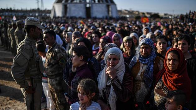 A picture taken on October 14, 2017 in the Kurdish town of Kobane in northern Syria shows people gathering for the funeral of a Kurdish fighter, who was killed in clashes against Islamic State (IS) group fighters in the city of Deir Ezzor. (AFP Photo) A picture taken on October 14, 2017 in the Kurdish town of Kobane in northern Syria shows people gathering for the funeral of a Kurdish fighter, who was killed in clashes against Islamic State (IS) group fighters in the city of Deir Ezzor. (AFP Photo)