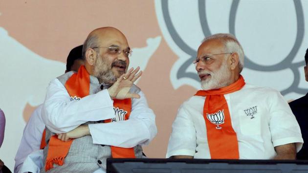 Prime Minister Narendra Modi with BJP President Amit Shah during “Gujarat Gaurav Mahasammelan” in Ahmedabad on Monday.(PTI Photo)