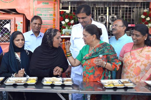 Chief minister Vasundhara Raje serves food to a woman during launch of Annpurna kitchen in Ajmer on Monday. (Deepak Sharma/HT Photo) Chief minister Vasundhara Raje serves food to a woman during launch of Annpurna kitchen in Ajmer on Monday. (Deepak Sharma/HT Photo)