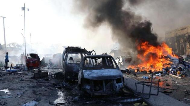 Witnesses said the attack was made even worse by the number of cars stuck on the road where one of the bombs exploded. ‘There was a traffic jam, and the road was packed with bystanders and cars,’ a waiter at a nearby restaurant said. (Feisal Omar / Reuters)