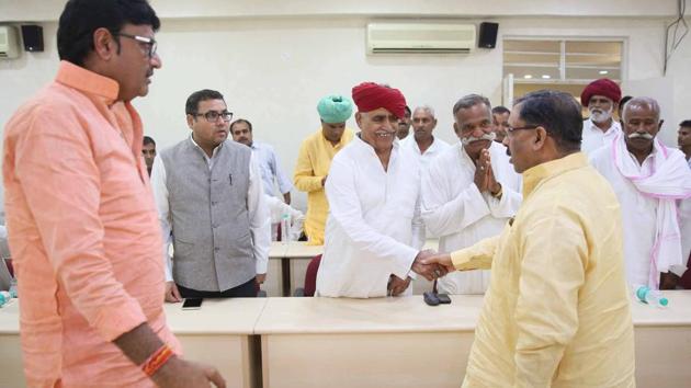 Cabinet Ministers Arun Chaturvedi (right) and Rajendra Rathore (second from left) exchange greetings with a delegation of Gujjar leaders, led by Col Kirori Singh Bainsla (third from left), before the meeting over the issue of Gurjar Reservation, at Indira Gandhi Panchaytiraj Institute in Jaipur on August 17. (HIMANSHU VYAS/HT PHOTO) Cabinet Ministers Arun Chaturvedi (right) and Rajendra Rathore (second from left) exchange greetings with a delegation of Gujjar leaders, led by Col Kirori Singh Bainsla (third from left), before the meeting over the issue of Gurjar Reservation, at Indira Gandhi Panchaytiraj Institute in Jaipur on August 17. (HIMANSHU VYAS/HT PHOTO)