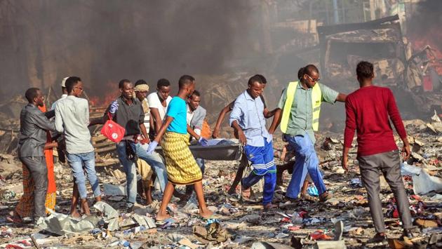 It was only after emergency workers began pulling body after body from the rubble of the nearly levelled downtown street over the weekend that the true magnitude of the attack came into sharper focus. (Mohamed Abdiwahab / AFP)