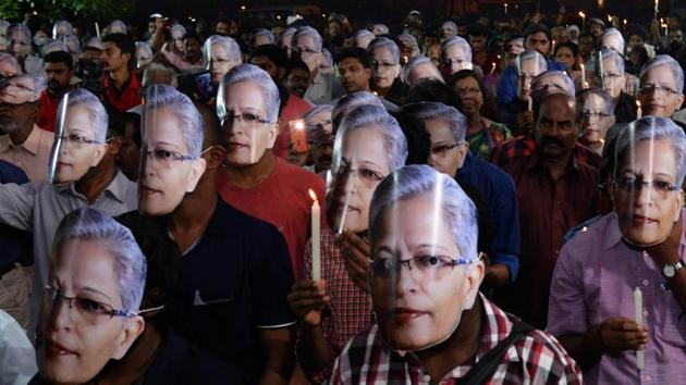 People wearing masks in a candle-light vigil to pay tribute to senior journalist and activist Gauri Lankesh in Thiruvananthapuram (PTI) People wearing masks in a candle-light vigil to pay tribute to senior journalist and activist Gauri Lankesh in Thiruvananthapuram (PTI)