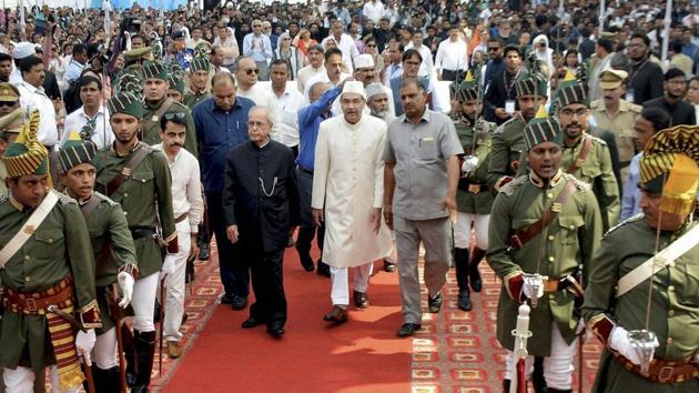 Former president Pranab Mukherjee with vice-chancellor Mohd Tariq Mansoor walk the red carpet during the 200th birth anniversary function of AMU founder Sir Syed Ahmed Khan at the Aligarh Muslim University on Tuesday. (PTI) Former president Pranab Mukherjee with vice-chancellor Mohd Tariq Mansoor walk the red carpet during the 200th birth anniversary function of AMU founder Sir Syed Ahmed Khan at the Aligarh Muslim University on Tuesday. (PTI)