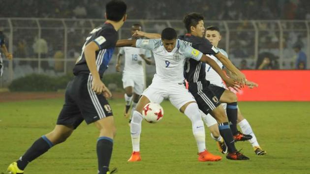 England and Japan players vie for the ball during their Round of 16 encounter. (samir jana/ht photo) England and Japan players vie for the ball during their Round of 16 encounter. (samir jana/ht photo)