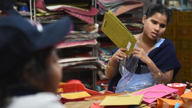 Vandana Gupta, a visually-impaired student, is seen making gift bags, which will go up on sale at the Blind School Diwali Mela, a popular event in New Delhi around the festival of lights.  (Sanchit Khanna / HT Photo) 