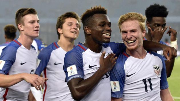 Tim Weah (2nd right) and Andrew Carleton (right) of USA celebrate the third goal against Paraguay during their FIFA U-17 World Cup round of 16 match at Jawaharlal Nehru Stadium in New Delhi on Monday. (Mohd Zakir/HT PHOTO) Tim Weah (2nd right) and Andrew Carleton (right) of USA celebrate the third goal against Paraguay during their FIFA U-17 World Cup round of 16 match at Jawaharlal Nehru Stadium in New Delhi on Monday. (Mohd Zakir/HT PHOTO)