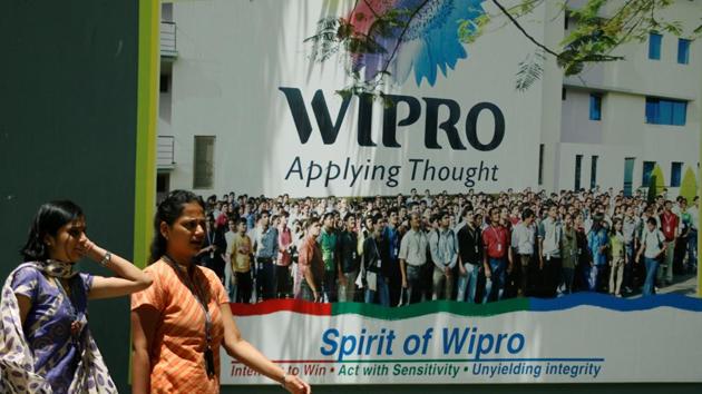 People walk in the Wipro campus in Bangalore. (Reuters File Photo) People walk in the Wipro campus in Bangalore. (Reuters File Photo)