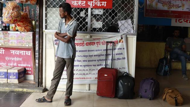 Passengers coming from various parts of the state, who were in Pune to board connecting buses, were also seen waiting at Swargate bus depot on Tuesday. (Rahul Raut/HT PHOTO) 