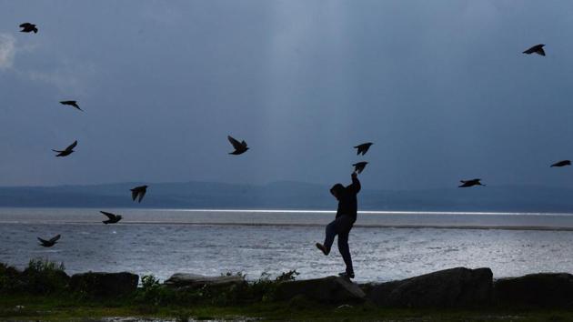 A man struggles against the wind on Mount Charles pier ahead of Hurricane Ophelia in Donegal, Ireland. Ireland’s weather service, Met Eireann, described the storm as the most powerful on record to have ever been this far east in the Atlantic. The government issued its most severe red weather warning whilst amber warnings remained in place for Northern Ireland and parts of Wales. (Charles McQuillan / Getty Images)