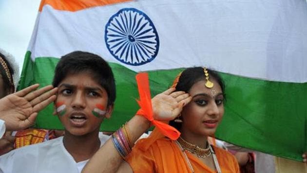 School children salute as they stand to attention and sing the national anthem Jana Gana Mana at a school in Hyderabad. (AFP file photo) School children salute as they stand to attention and sing the national anthem Jana Gana Mana at a school in Hyderabad. (AFP file photo)