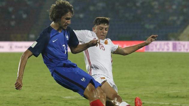 France's Yacine Adli, left, fights for control of the ball against Spain's Cesar Gelabert. (AP) France's Yacine Adli, left, fights for control of the ball against Spain's Cesar Gelabert. (AP)