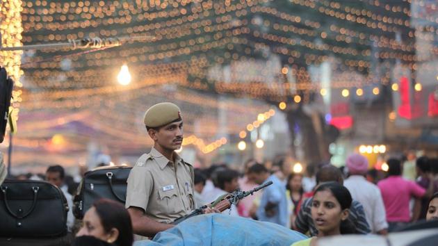 Delhi Police officer on duty during the time of festivities. (Raj K Raj/ HT Photo) Delhi Police officer on duty during the time of festivities. (Raj K Raj/ HT Photo)