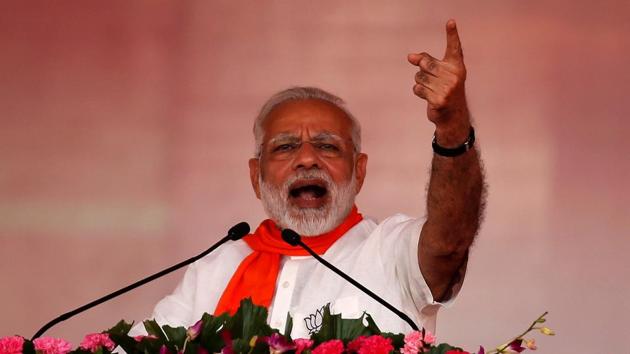 Prime Minister Narendra Modi addresses his supporters during a public rally at Bhaat village on the outskirts of Ahmedabad on October 16.(REUTERS)