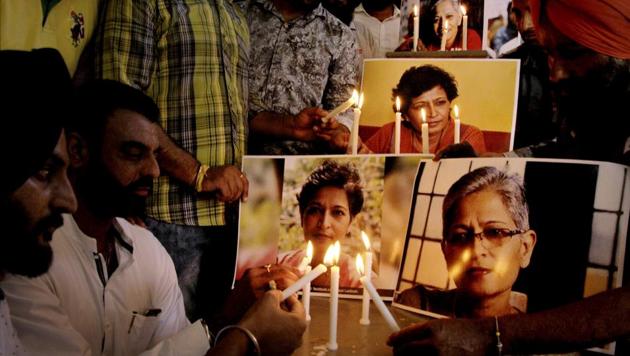 Members of the National Human Rights and Crime Control Organisation light candles in Amritsar to condemn the killing of journalist Gauri Lankesh. (PTI) Members of the National Human Rights and Crime Control Organisation light candles in Amritsar to condemn the killing of journalist Gauri Lankesh. (PTI)