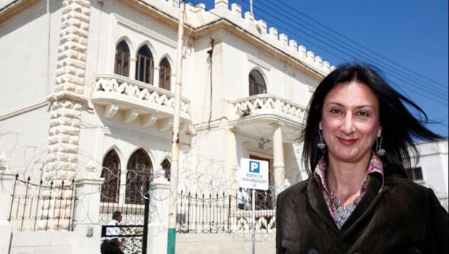 Maltese investigative journalist Daphne Caruana Galizia poses outside the Libyan Embassy in Valletta on April 6, 2011.(REUTERS)