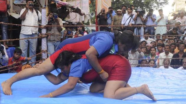 Female wrestlers, too, took part in the competition. They participated simply for the love of the sport. The first prize for the winner in each category was a track suit and the runner up got a tee shirt. (Samir Jana / HT Photo)