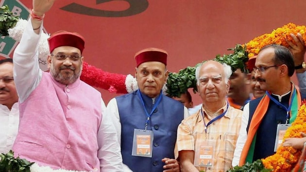 BJP president Amit Shah with Union health minister JP Nadda, senior leaders Shanta Kumar and Prem Kumar Dhumal and Himachal Pradesh BJP chief Satpal Singh Satti at the party’s “Yuva Hunkar Rally” at Kangra near Dharamsala. (PTI File) BJP president Amit Shah with Union health minister JP Nadda, senior leaders Shanta Kumar and Prem Kumar Dhumal and Himachal Pradesh BJP chief Satpal Singh Satti at the party’s “Yuva Hunkar Rally” at Kangra near Dharamsala. (PTI File)