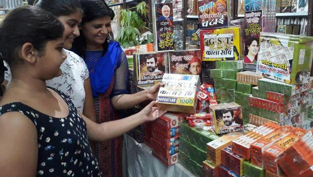 People buy firecrackers inspired by GST and demonetisation in Allahabad. (Sheeraz Rizvi / HT photo) People buy firecrackers inspired by GST and demonetisation in Allahabad. (Sheeraz Rizvi / HT photo)