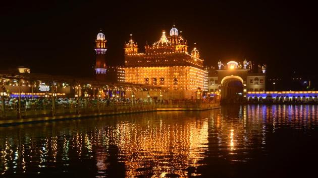 Golden Temple illuminated on the eve of Diwali festival in Amritsar on Wednesday. (Sameer Sehgal/HT)