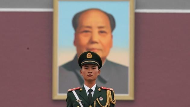 A paramilitary policeman stands at the Tiananmen gate, a day before the congress. Attention will also be paid to any moves that would enable Xi to stay on in a leadership capacity after his second term ends in 2022. One of the most important signals would be whether Xi is referred to as ‘lingxiu’, or leader, an honorific has been bestowed on only Mao and his short-lived successor, Hua Guofeng since 1949. (Aly Song / REUTERS)