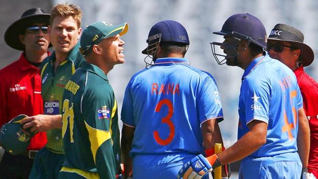 David Warner argues with Rohit Sharma as Suresh Raina tries to intervene during their ODI tri-series match at the Melbourne Cricket Ground in 2014-15.(Reuters)