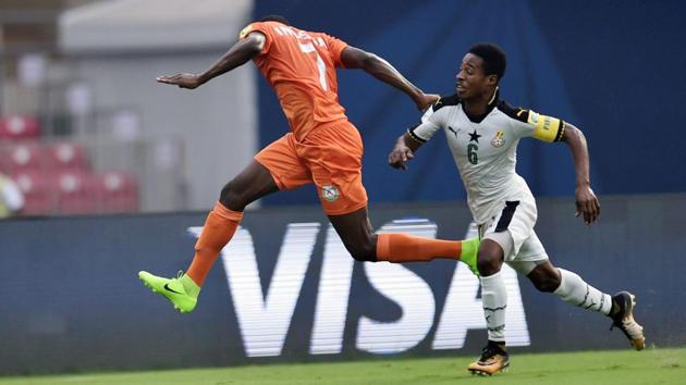 Niger player Inoussa Amadou (Orange) and Ghana player Eric Ayiah in action. (PTI)