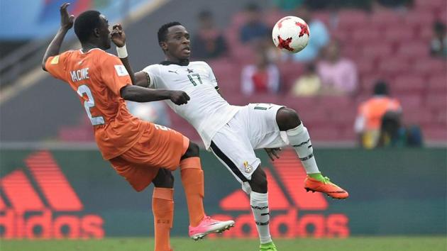 Niger player Yachine Wa Massamba (Orange, jersey) and Ghana player Rashid Alhassan in action. (PTI)