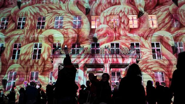 Light projections featuring flamingos cover the facade of the ‘Palais am Festungsgraben’ on the last day of the yearly Festival of Lights in Berlin. (John Macdougall / AFP)