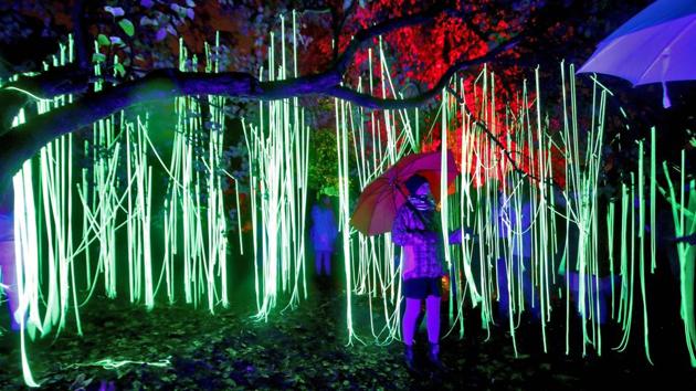 A visitor is surrounded by a light installation during the 7th International Vilnius Light Festival ‘Beepositive 2017’ in Lithuania. This lighting, design and installation festival is held every year in autumn with every Beepositive visitor not just as a guest, but also a participant. (Petras Malukas / AFP)