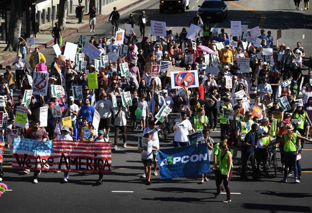 People march as they participate in the '#NoMuslimBanEver' rally in downtown Los Angeles, California on October 15, 2017. (AFP) People march as they participate in the '#NoMuslimBanEver' rally in downtown Los Angeles, California on October 15, 2017. (AFP)