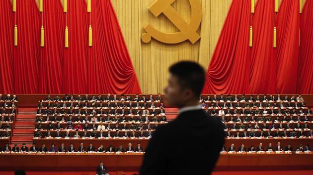A soldier in an usher uniform stands watch as Chinese President Xi Jinping delivers a speech at the opening ceremony of the 19th Party Congress at the Great Hall of the People in Beijing on October 18. (AP Photo) A soldier in an usher uniform stands watch as Chinese President Xi Jinping delivers a speech at the opening ceremony of the 19th Party Congress at the Great Hall of the People in Beijing on October 18. (AP Photo)