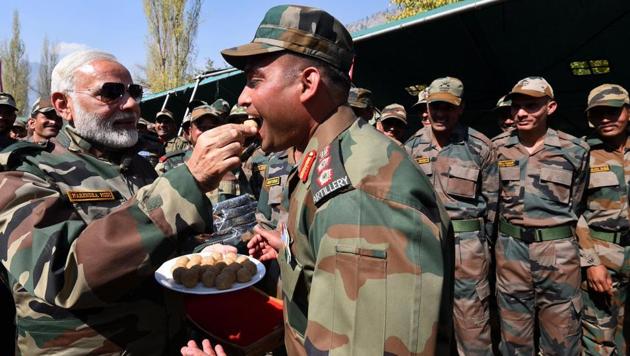 Prime Minister Narendra Modi offers sweets to a jawan on the occasion of Diwali in Gurez Valley in Jammu and Kashmir on Thursday. (Photo: Narendra Modi Twitter)