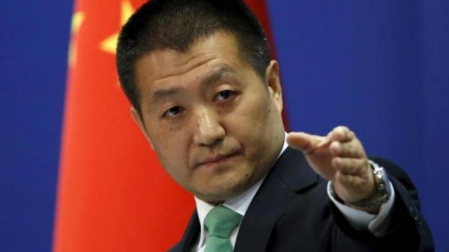 Chinese Foreign Ministry spokesman Lu Kang points out a reporter to receive a question at a regular news conference in Beijing, October 27, 2015.(Reuters File Photo)