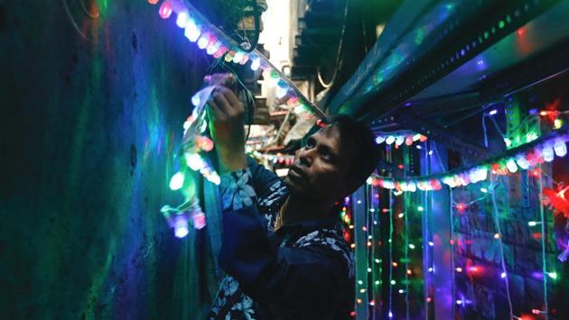 A man hangs lights in an alley on the eve of Diwali in a slum in Mumbai, Maharashtra. A time to celebrate and connect with friends and family, Diwali n modern India has almost become synonymous with bursting firecrackers. The Supreme Court’s recent ban on firecrackers in Delhi NCR this year while met with mixed responses, has also resulted in awareness for the importance of safer, greener alternatives. (Danish Siddiqui / REUTERS)