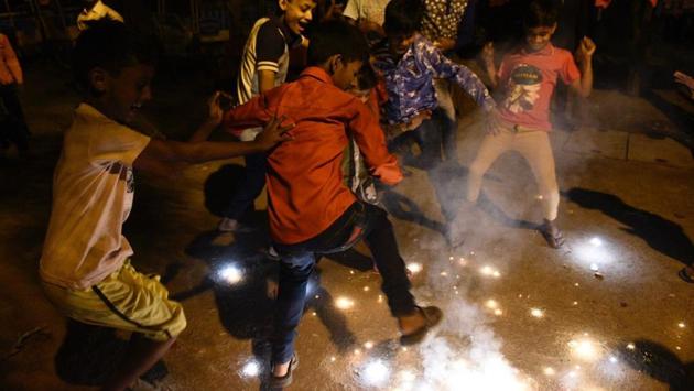 Children burst crackers on the occasion of ‘Diwali’ in New Delhi. The Supreme Court on October 9 had banned the sale of firecrackers in the Delhi NCR region until October 31. However, there was no such order against buying and bursting, and Delhi is solely responsible for the air it breathes due to the current weather conditions. (Burhaan Kinu / HT Photo)
