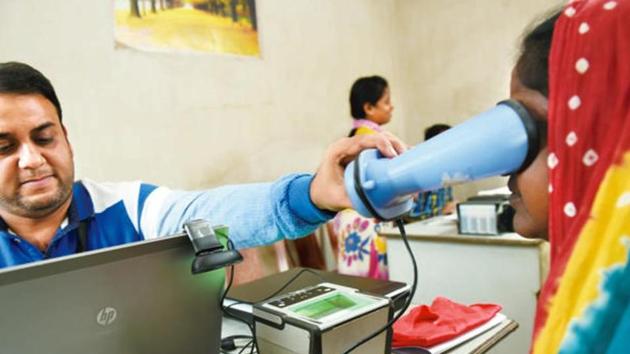 A woman gets her iris scanned while registering for an Aadhaar number. The UIDAI had on July 14 asked banks to open Aadhaar enrolment and updating facilities in at least one-tenth of their branches by the end of August. (Mint File Photo) A woman gets her iris scanned while registering for an Aadhaar number. The UIDAI had on July 14 asked banks to open Aadhaar enrolment and updating facilities in at least one-tenth of their branches by the end of August. (Mint File Photo)