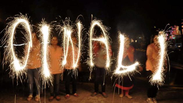 Children celebrate Diwali. (PTI) Children celebrate Diwali. (PTI)