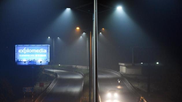 High level of smog seen in the street lights after Diwali celebrations in New Delhi. Environmental pollution — from filthy air to contaminated water is known to kill more people every year than war and violence in the world. (Mohd Zakir / HT PHOTO)