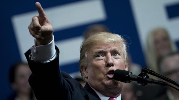 This file photo taken on September 22, 2017 shows US President Donald Trump speaking during a rally for Alabama state Republican Senator Luther Strange at the Von Braun Civic Center in Huntsville, Alabama. Trump triggered a backlash from the US professional sports world on September 23, 2017, withdrawing a White House invitation to the NBA champion Golden State Warriors after condemning NFL players protesting the national anthem. A day after Trump had decried activist National Football League stars as "sons of bitches" who should be fired for kneeling or sitting during renditions of The Stars and Stripes, the US leader turned his ire to basketball's reigning champions and star player Stephen Curry.Curry said he would not attend a White House reception if his team was invited in accordance with a tradition that stretches back several decades.(AFP)