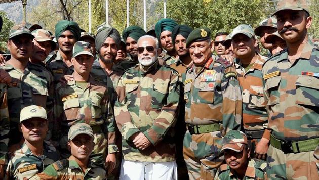 Prime Minister Narendra Modi with the jawans of the Indian Army and BSF, in the Gurez Valley, near the Line of Control, in Jammu and Kashmir, on Thursday. (PTI Photo) Prime Minister Narendra Modi with the jawans of the Indian Army and BSF, in the Gurez Valley, near the Line of Control, in Jammu and Kashmir, on Thursday. (PTI Photo)