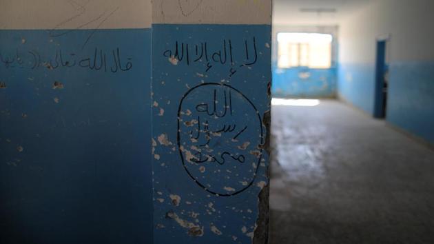 An emblem of the Islamic State along with damage from gunfire is seen inside a school during an earlier leg of the battle for Raqqa in Hazema, Syria on August 21, 2017. (Zohra Bensemra / REUTERS)